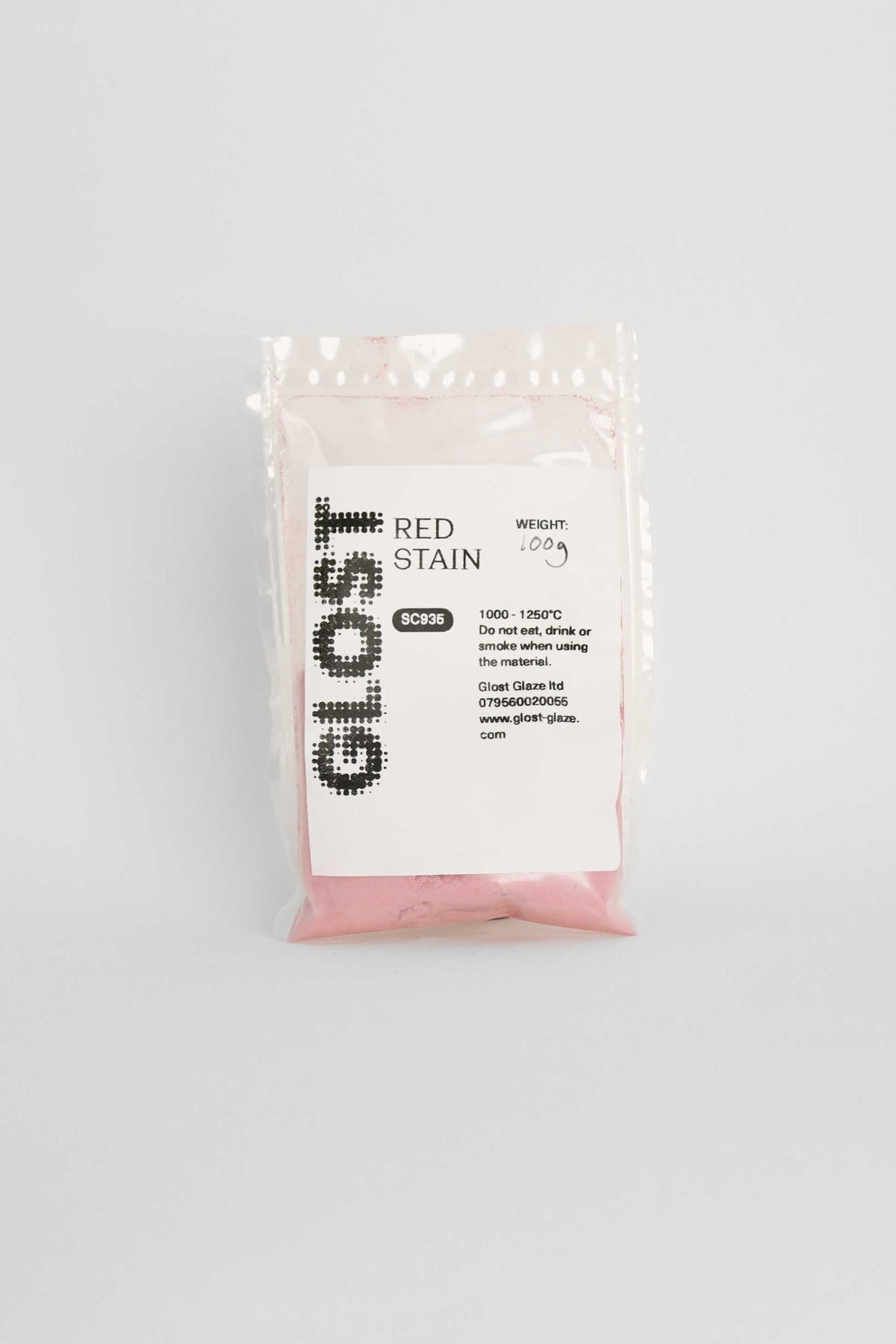 Red ceramic stain by GLOST Glaze, 100g sachet, for colouring glazes, slips, and clay bodies. Made in Britain.