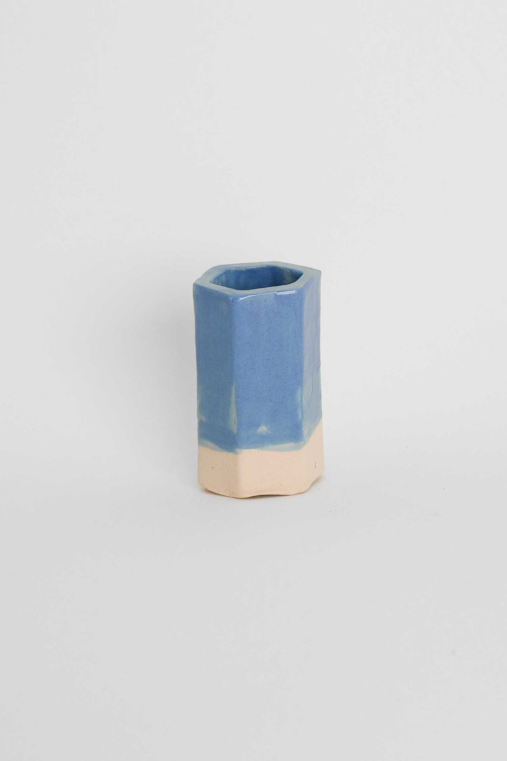 Fired sample tile showing Sky Blue ceramic stain by GLOST Glaze in a transparent glaze on white stoneware