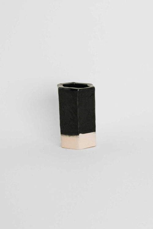 Fired sample tile showing Black ceramic stain by GLOST Glaze in a transparent glaze on white stoneware
