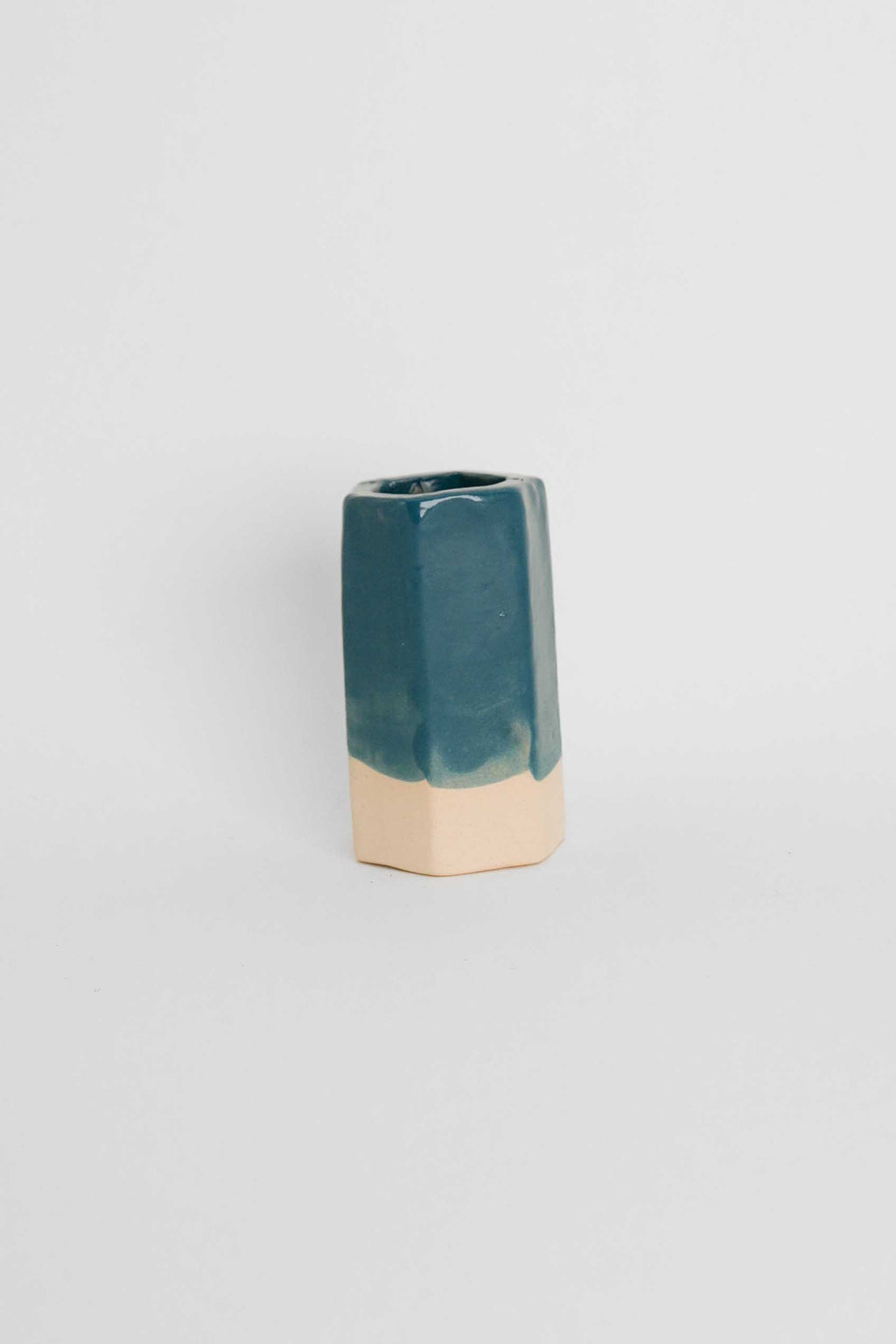 Fired sample tile showing Teal ceramic stain by GLOST Glaze in a transparent glaze on white stoneware