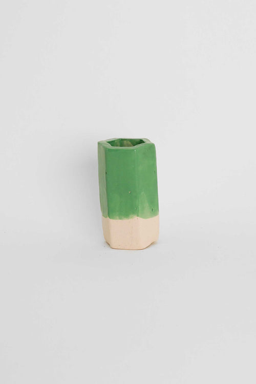 Fired sample tile showing Apple Green ceramic stain by GLOST Glaze in a transparent glaze on white stoneware