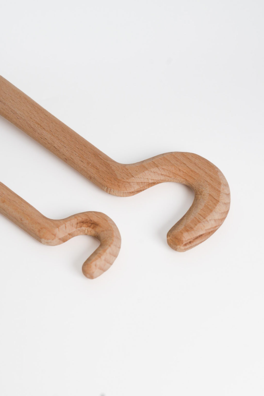 The GLOST Throwing Hook Stick, a long-handled wooden tool for shaping the inside of narrow thrown pots.