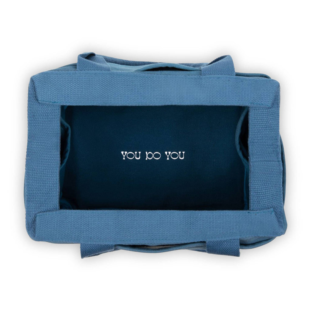 Blue bag with 'YOU DO YOU' text on a white background